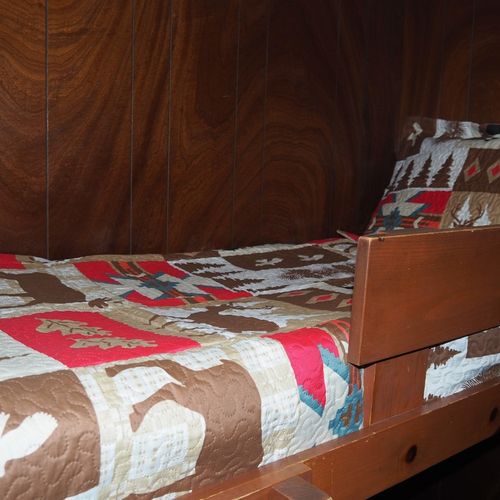 Bedroom #3:  features a twin-on-twin bunk bed and a dresser.
