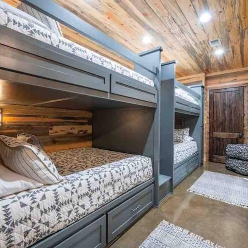 The bunk room is also downstairs and has 4 Queen beds.
