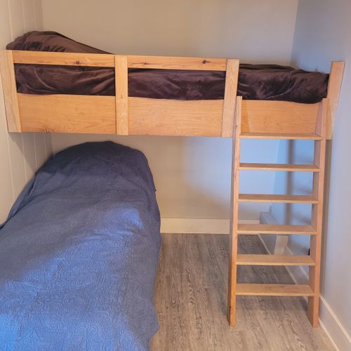 Bedroom #6 (beach house, main floor):  features two twin beds. Note that there is not a private door to the bedroom.