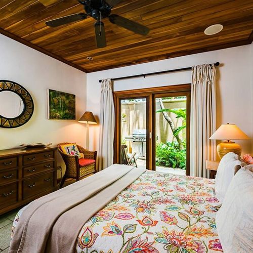 With an elegant style and decoration, the master bedroom has a queen size bed.
