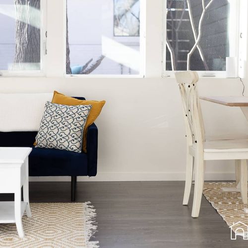 - snuggle into the navy couch with soft pillows and cozy layered textures
- enjoy morning coffee or a casual meal at the charming farmhouse style table
- bright natural light and thoughtful touches make this space feel like home