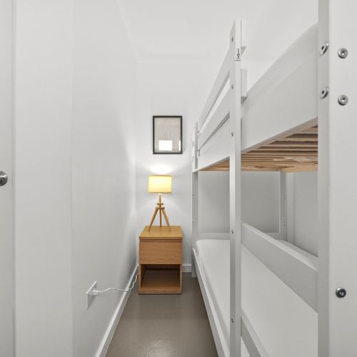 Sleep tight, times two! Bunk bed magic for this shared bedroom.