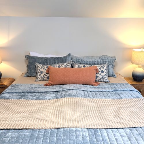 BEDROOM #2 (SECOND FLOOR):  Beautiful newly-decorated second floor bedroom with a king-size bed, private television, nightstands, lamps, dresser, and closet.