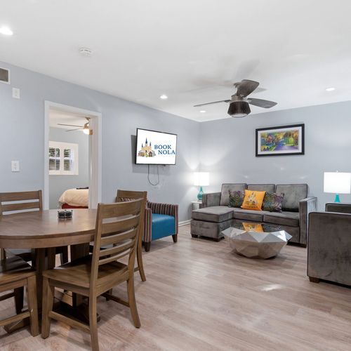 Bright dining area w/ a big table perfect for shared meals