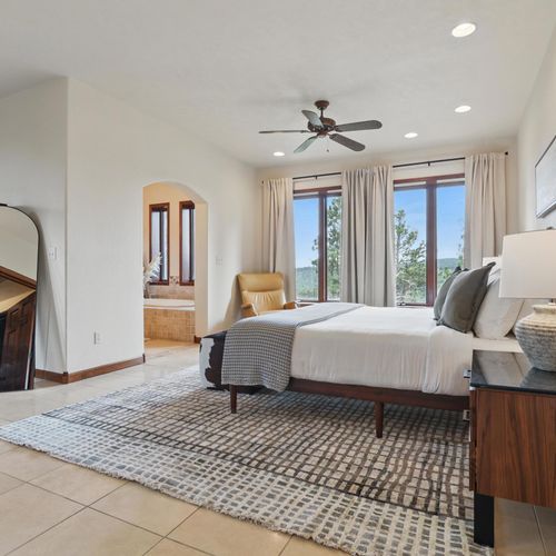 Rest comes easy in this airy, quiet space with a cozy queen-size bed.