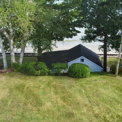 Beach house:  aerial view of the backyard and the beach house.