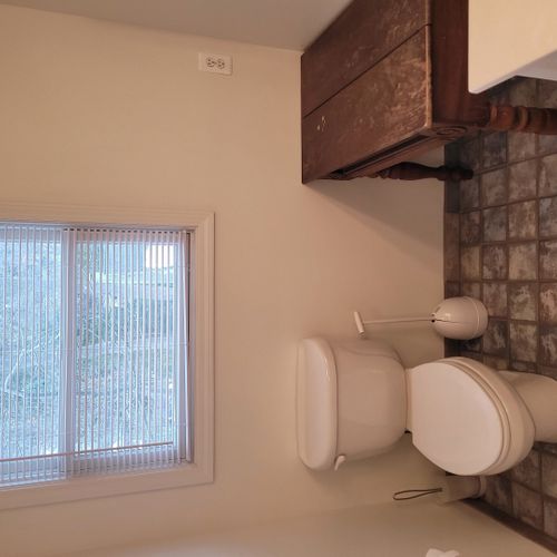Bathroom #2 (upper level):  full bathroom that is a private en suite bathroom for bedroom #2