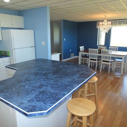 Kitchen:  another view of the large island in the kitchen, looking out towards the dining room.