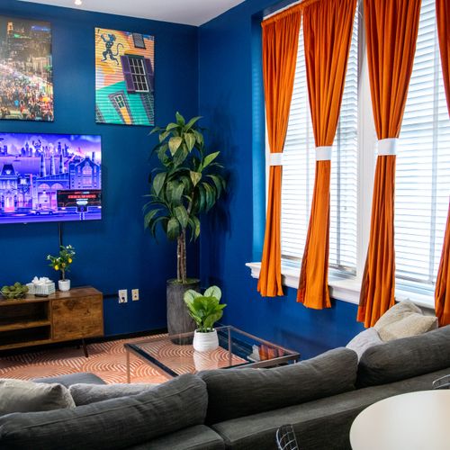 Bold art, warm light & rich color — a living space that feels unmistakably New Orleans.