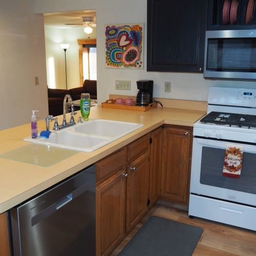Kitchen:  newly remodeled kitchen with stainless steel appliances, including a dishwasher and microwave.