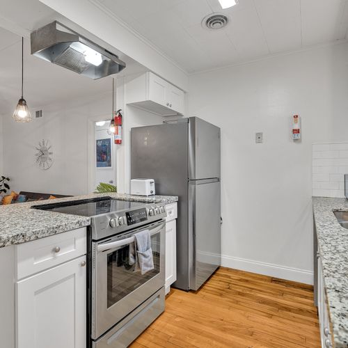 Start your day at the breakfast bar with a cup of coffee before heading out to explore! This kitchen’s bright and inviting design makes it a joy to use.