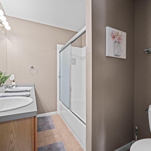 Bright shower space offering comfort and simplicity