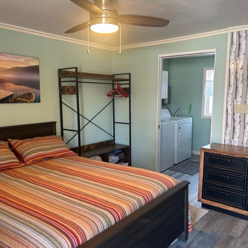 Overall:  overview of the bedroom highlighting the queen-size bed.