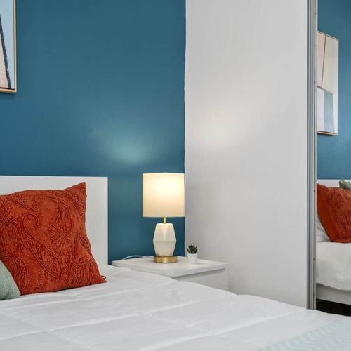 Retreat into this peaceful space featuring white and blue-themed interiors.