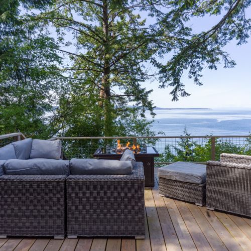 Relax by the gas firepit with plenty of seating and infinity deck for clear views.