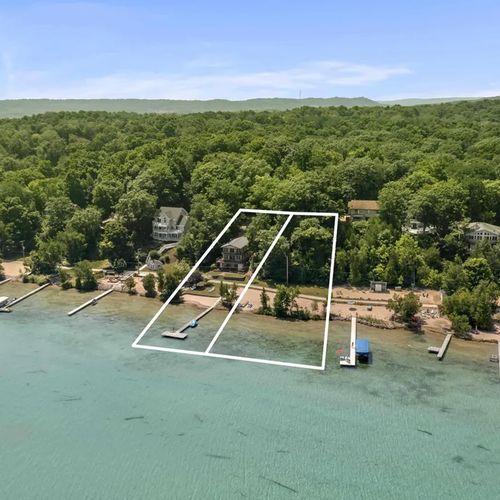 EXTERIOR:   Another aerial photo showing the 2 lakefront lots that are included with the property