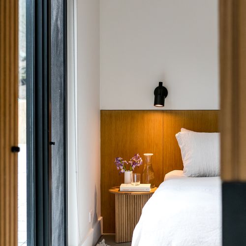 Cozy primary bedroom with soft ambient lighting.