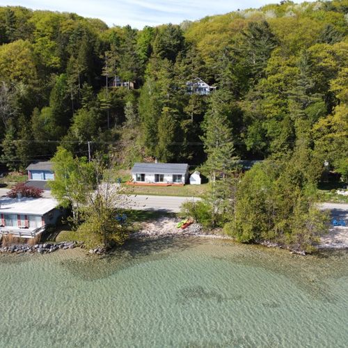 Exterior:  a broader aerial photo of the cottage and crystal lake. Note how incredibly clear the water is! :-)