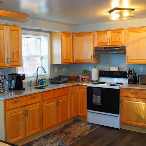 Kitchen:  large kitchen with all appliances (except a dishwasher), including a gas range, toaster, and a keurig coffee maker. Also includes lots of storage space and a good supply of cooking and dining utensils.