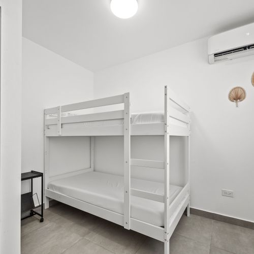 Perfect for families or groups, this cozy bedroom features a fun and spacious bunk bed for a restful night's sleep.