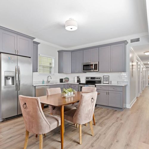 Spacious kitchen w/ dining table — plenty of room for the whole group to gather.