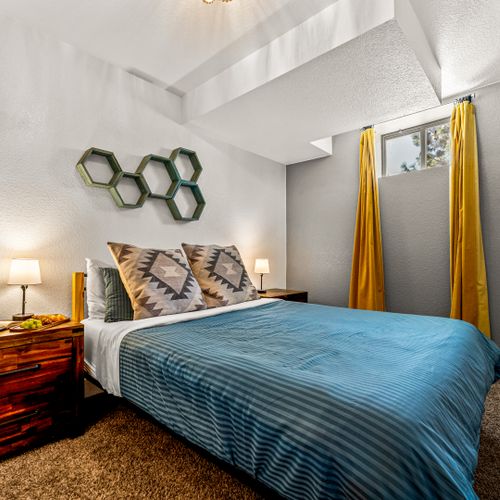 Relax in a space where soft carpets and clean design offer a peaceful reset.