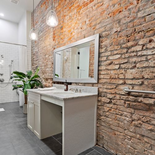 Historic brick walls in the huge bathroom