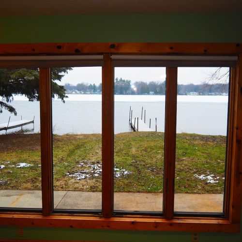 Overview:  the great view of the backyard, lake, and private dock from the living room.