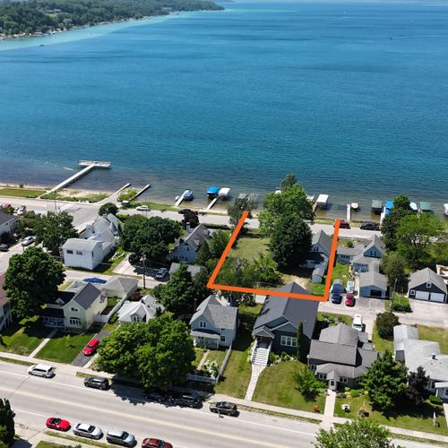 EXTERIOR:  Another aerial view showing the borders of the property in orange with Crystal Lake in the background.