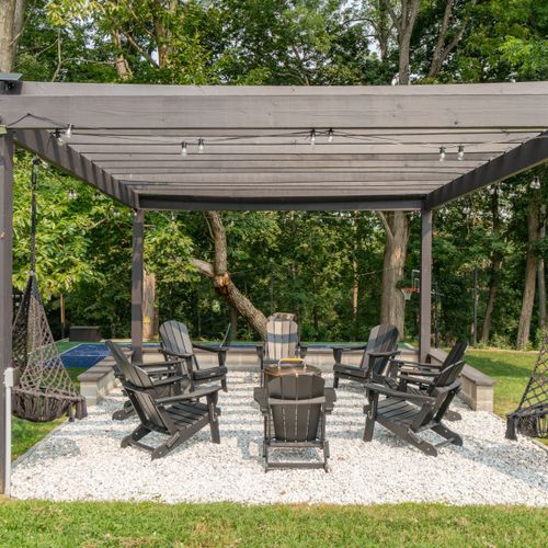 Whether in an Adirondack chair or hammock swing, you'll love sitting by the fire pit.