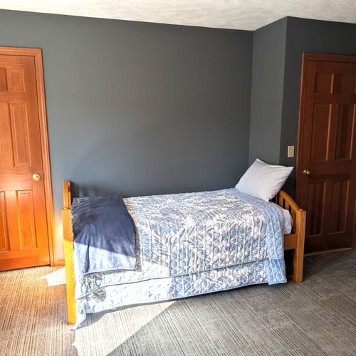 BEDROOM #5 (SECOND FLOOR):  Mixed up bedroom on the second floor with a trundle bed, loveseat, and a washer and dryer.