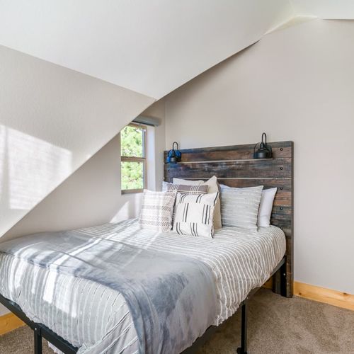 The cozy bedroom provides a cozy space to settle in and relax