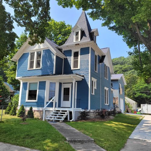 Overall:  the front of the house in summer.