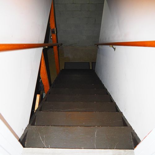 Stairs:  stairs down to the basement, where the washer and dryer is located.