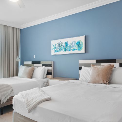 Rest easy in your cozy haven. Comfortable queen bed & thoughtful design ensure a peaceful night's sleep.