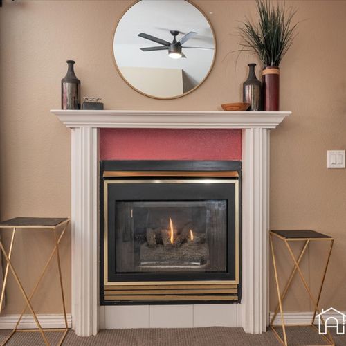 Enjoy the convenience of an electric fireplace, creating a cozy and warm atmosphere during colder evenings.