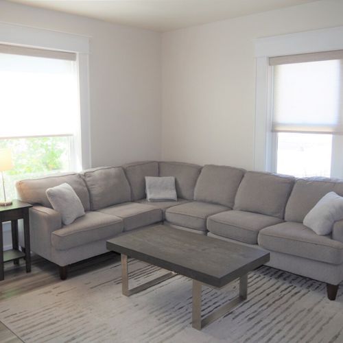 Living room:  gorgeous living room that features a gas fireplace and a large television with live streaming via hulu, netflix, and disney+.
