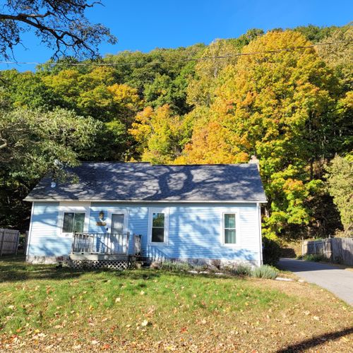 Overall:  the front of the house in the fall with the elberta dunes in the background.