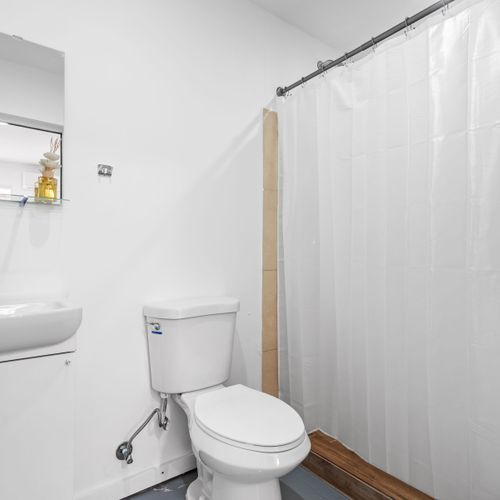 Pristine bathroom with all the comforts of home.