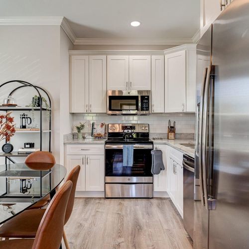 Fully equipped kitchen w/ stainless steel appliances & sleek modern finishes.