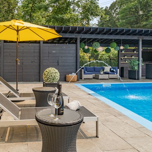 These unique tables double as poolside coolers. Simply pop up the top, fill with ice and voila- cold champagne on a hot day.