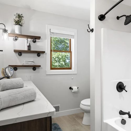 BATHROOM #3 (UPPER LEVEL):  Full common bathroom with a combination tub and shower for the upper level (i.e. third floor)