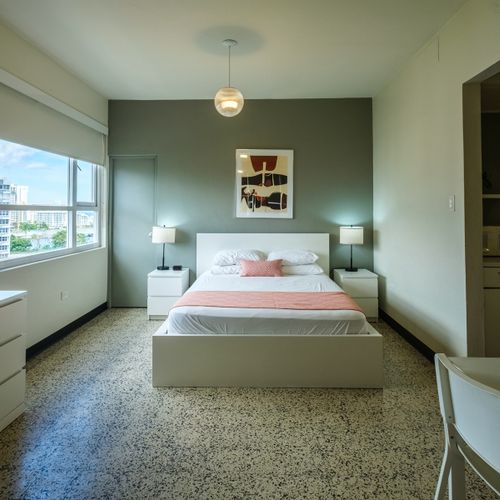 Step into a peaceful retreat designed for your ultimate relaxation. This comfortable bedroom provides a tranquil space for a restful night's sleep.