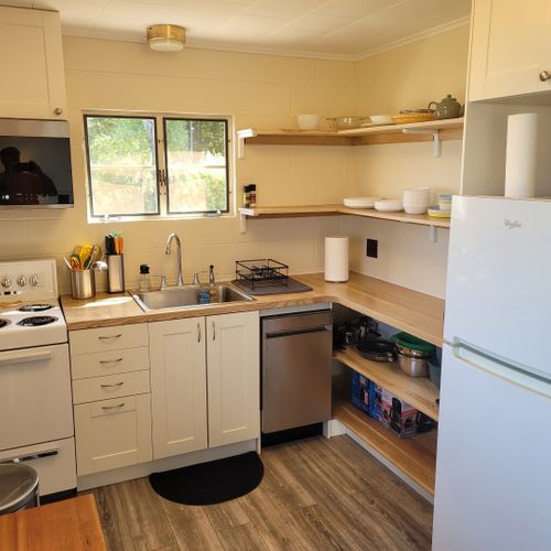 Kitchen:  the home has a very cute and newly updated kitchen with all appliances, including a dishwasher. Also includes a small breakfast nook with stools and a great view of crystal lake!