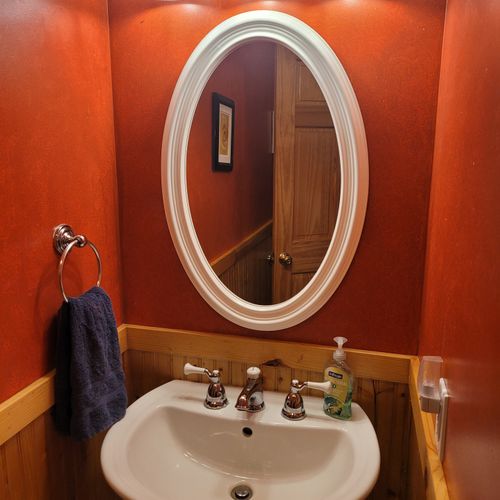 Bathroom #1 (main floor):  cute half-bath with sink, mirror, and toilet on the main floor.