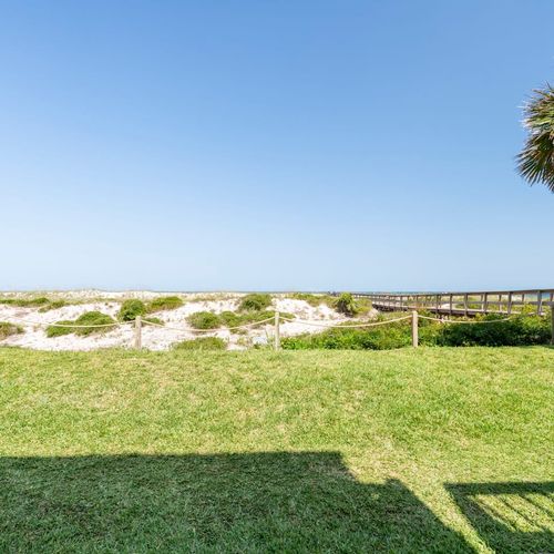 Embrace the sea breeze and unwind on your own private patio. Walk straight out to the sandy shores!