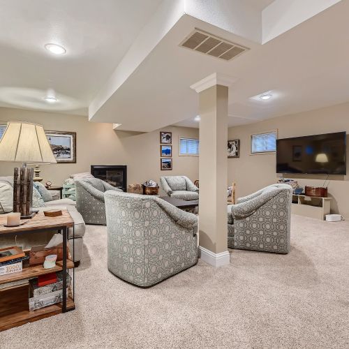 This room has both a large, 65" tv and a fireplace for ambience and warmth.