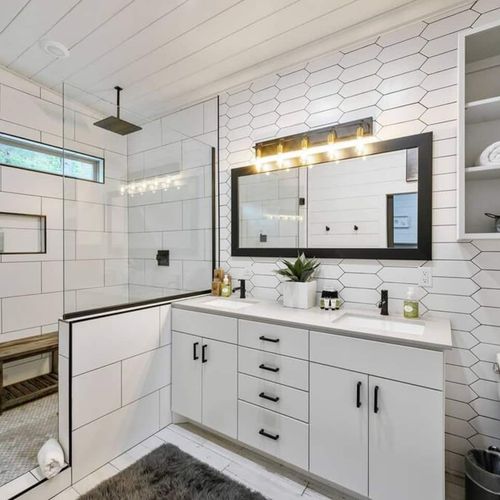 A double vanity and luxury double head rain shower.