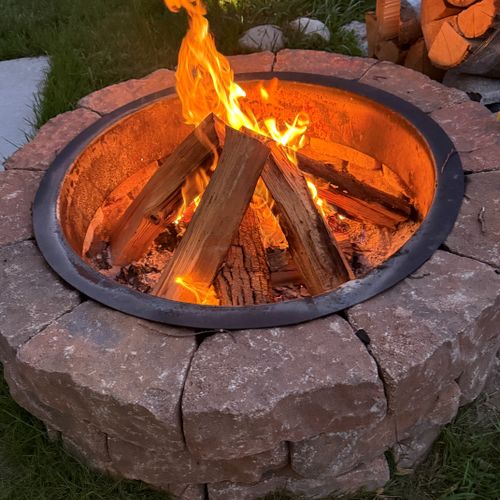 EXTERIOR:  The home has a great bonfire ring for wonderful family times together!