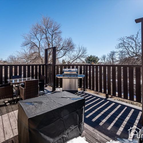 - private deck with bbq grill, outdoor dining set, and tall fencing for added privacy
- perfect for outdoor meals or lounging in the sun with a cup of coffee or evening wine
- natural wood planks and tree lined views complete this relaxing retreat